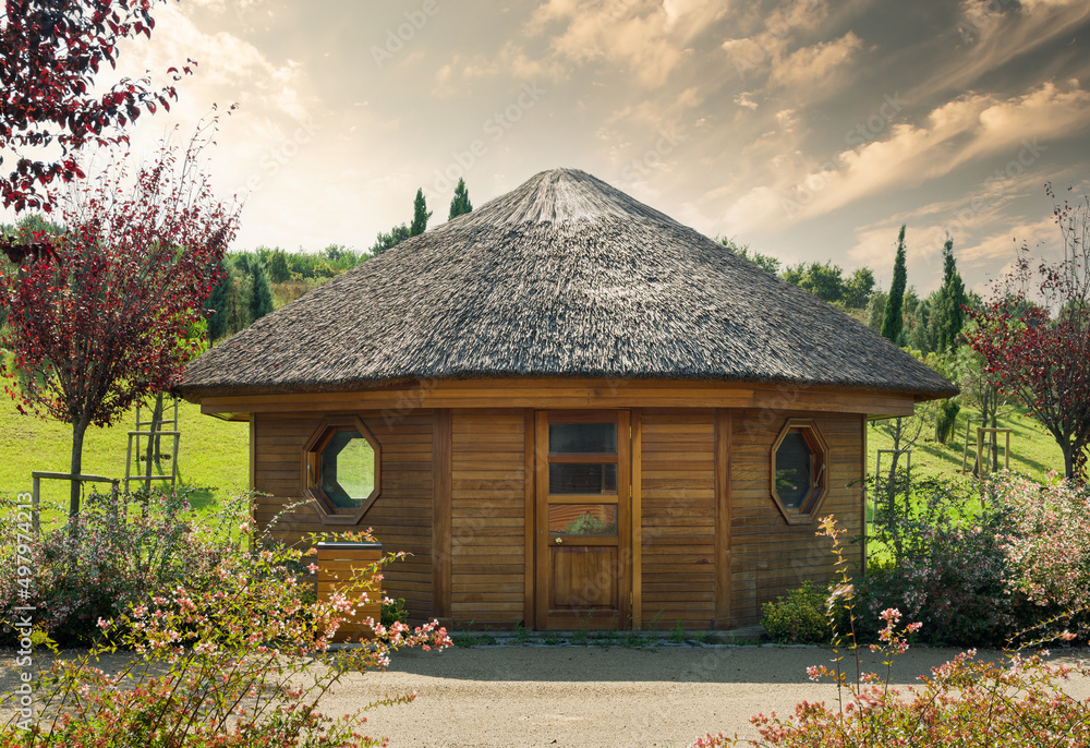 Small cute wooden cabin. Tiny house in the park. Small cute wooden cabin. Tiny house in the park.