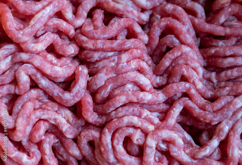 raw minced beef meat background, close up. raw minced beef meat background, close up.