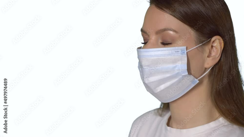 Young caucasian beautiful woman put on protective face mask. Young caucasian beautiful woman put on protective face mask.