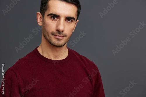 portrait man in a red sweater hand gesture posing self confidence isolated background