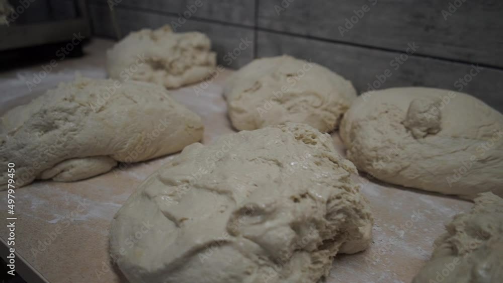 Man kneads the dough with his hands, close-up, prepares the dough for bread and pastries at home Man kneads the dough with his hands, close-up, prepares the dough for bread and pastries at home