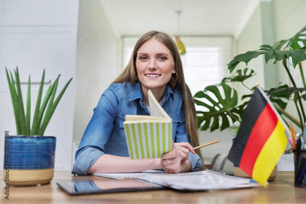 Young female student looking at webcam while talking. Young female student looking at webcam while talking.