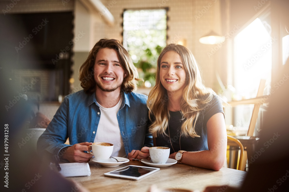 Love and coffee. Shot of a couple enjoying a double date with friends in a coffee shop. Love and coffee. Shot of a couple enjoying a double date with friends in a coffee shop.