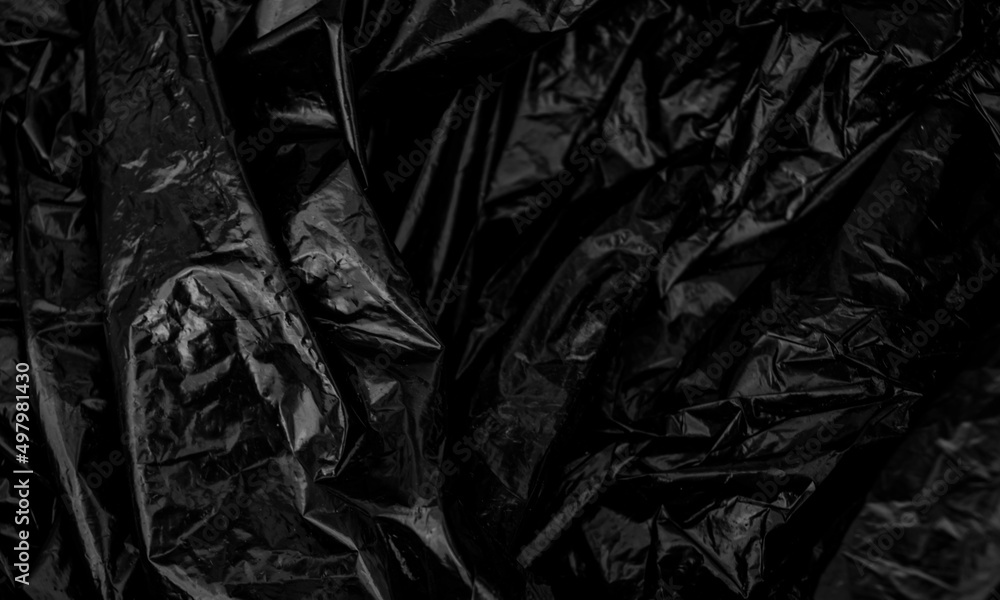 black plastic bag texture, wrap texture on a black background wallpaper,  wrinkled plastic pattern for creative and decorative design Stock Photo |  Adobe Stock