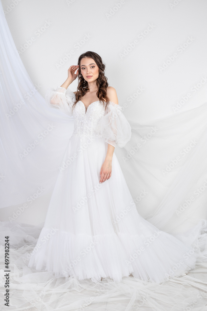 Beautiful sexy woman brunette in fashion long dress for party wedding. Bride natural model with natural makeup style for celebrity white background