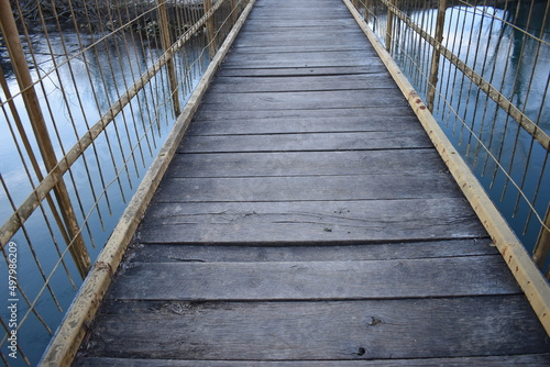 wooden bridge on the river © Tanja