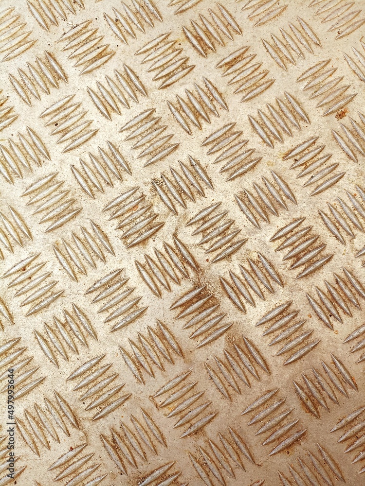 Obraz premium Stamped metal background pattern with light rust on silver surface