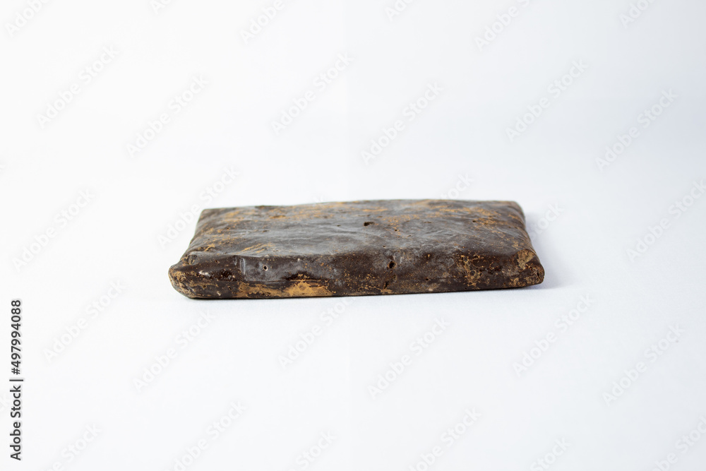 piece of homemade chocolate ,pure cocoa with white background piece of homemade chocolate ,pure cocoa with white background