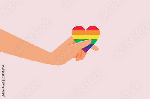 Hand Holding a Rainbow Heart symbol of Love and Inclusivity
