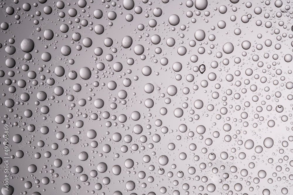 Drops of water on a transparent gray background. Drops of water on a transparent gray background.