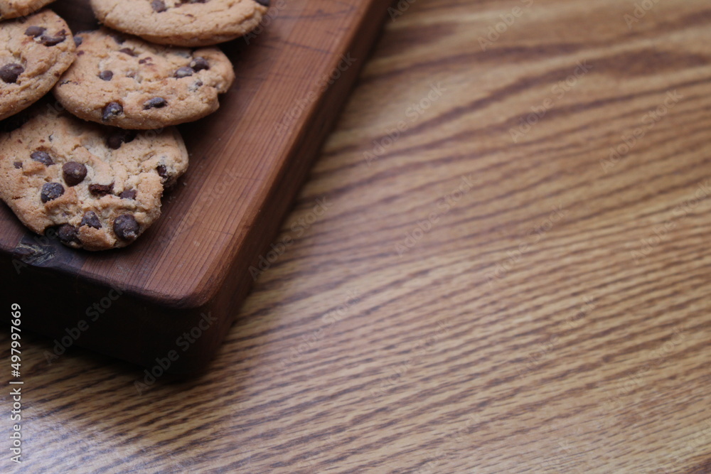 Delicious chocolate cookies placed on a wooden table Delicious chocolate cookies placed on a wooden table
