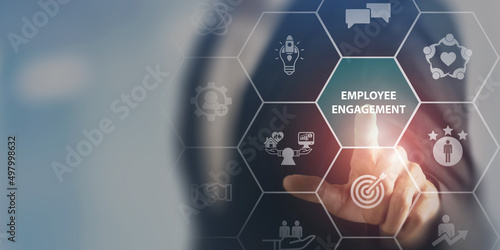 Employee engagement and team motivation. Productive people, inspiration. Common goals of the company and employees for sustainability. Touching on employee engagement text sourrounded by engage icons. photo