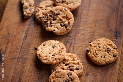 Delicious chocolate cookies placed on a wooden table