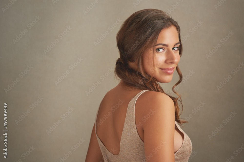 You are enough. Studio shot of an attractive young woman posing against a brown background. You are enough. Studio shot of an attractive young woman posing against a brown background.