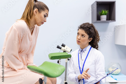 Gynecologist talking with young female patient during medical consultation in modern clinic. Patient with a gynecologist during the consultation in the gynecological office