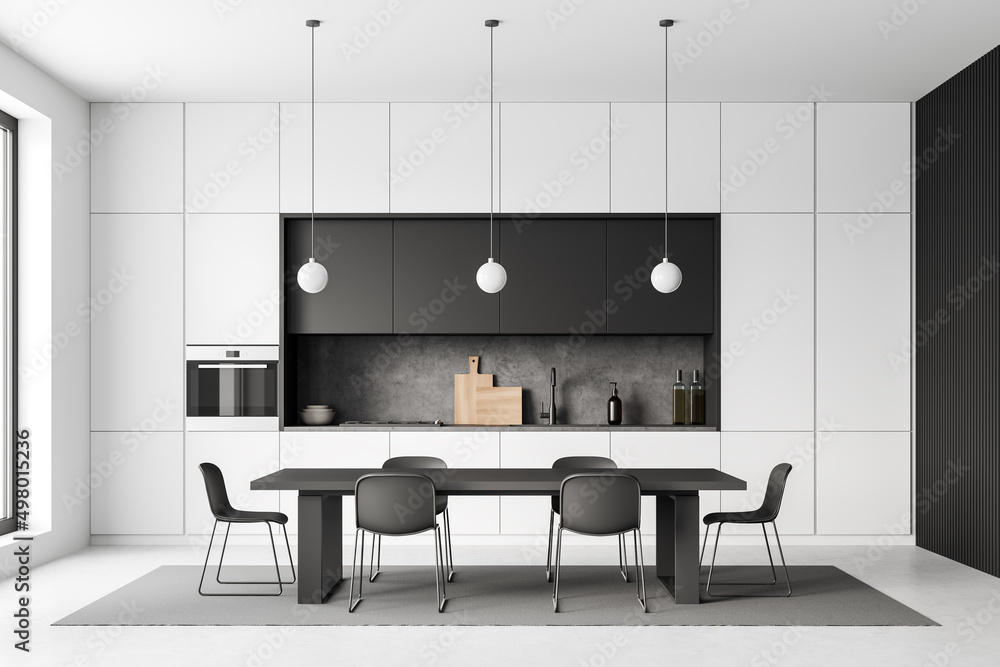 Light kitchen interior with chairs and dining table on carpet, window Light kitchen interior with chairs and dining table on carpet, window