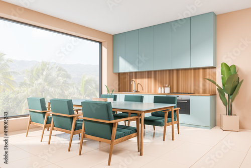 Light dining interior with table and seats, kitchenware and panoramic window © ImageFlow