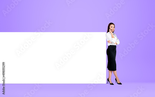 Businesswoman call on the phone, standing near mockup whiteboard © ImageFlow