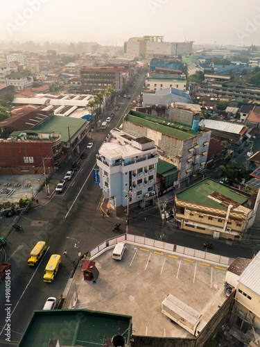 Olongapo, Zambales, Philippines - April 2022: Aerial of the cityscape of Olongapo City during a hazy day. photo