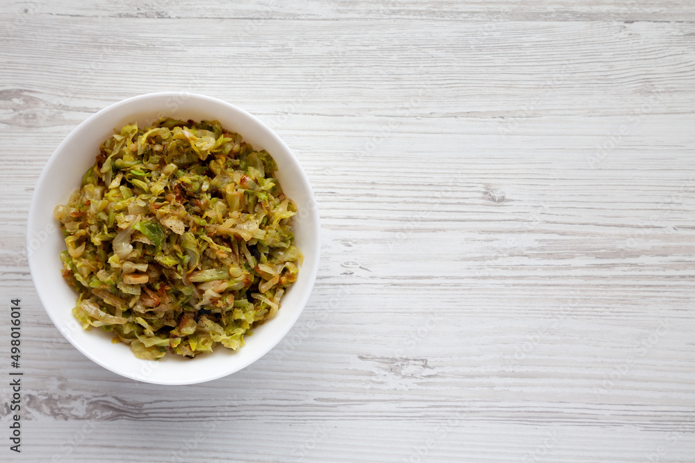 Homemade Irish Sauteed Cabbage in a Bowl, top view. Flat lay, overhead, from above. Space for text. Homemade Irish Sauteed Cabbage in a Bowl, top view. Flat lay, overhead, from above. Space for text.
