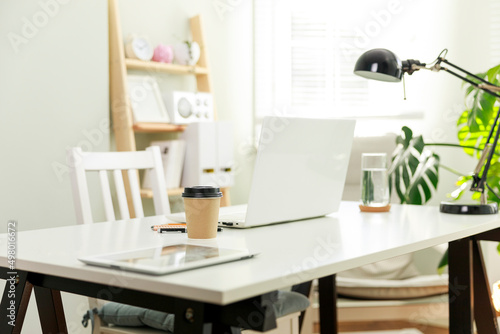 The cosy workplace of a businesswoman working from home.