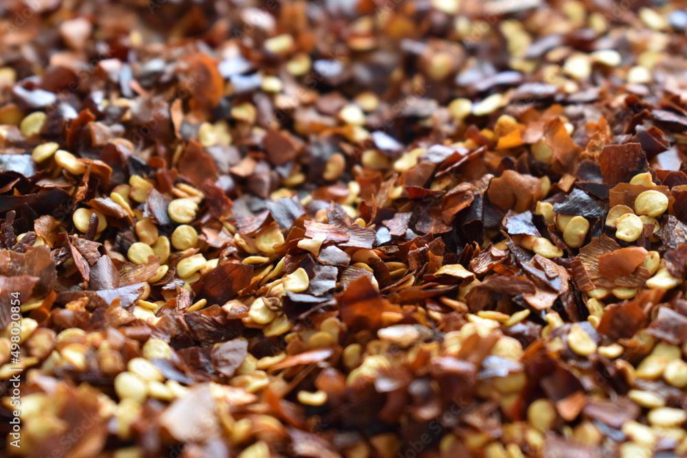Dried chilli flakes texture background. Dried chilli flakes texture background.