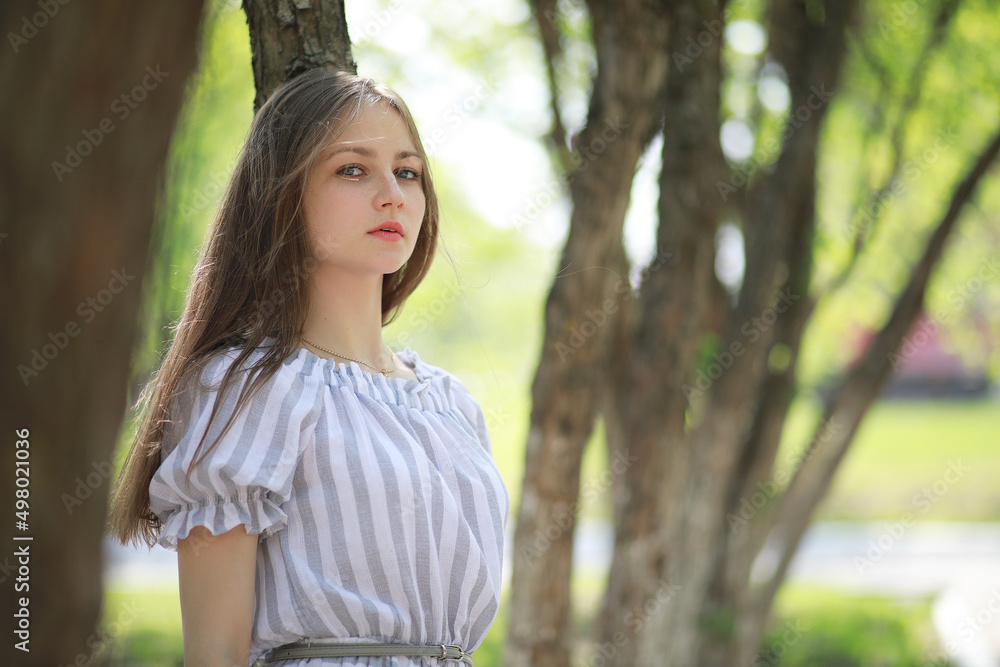A girl in a spring green park