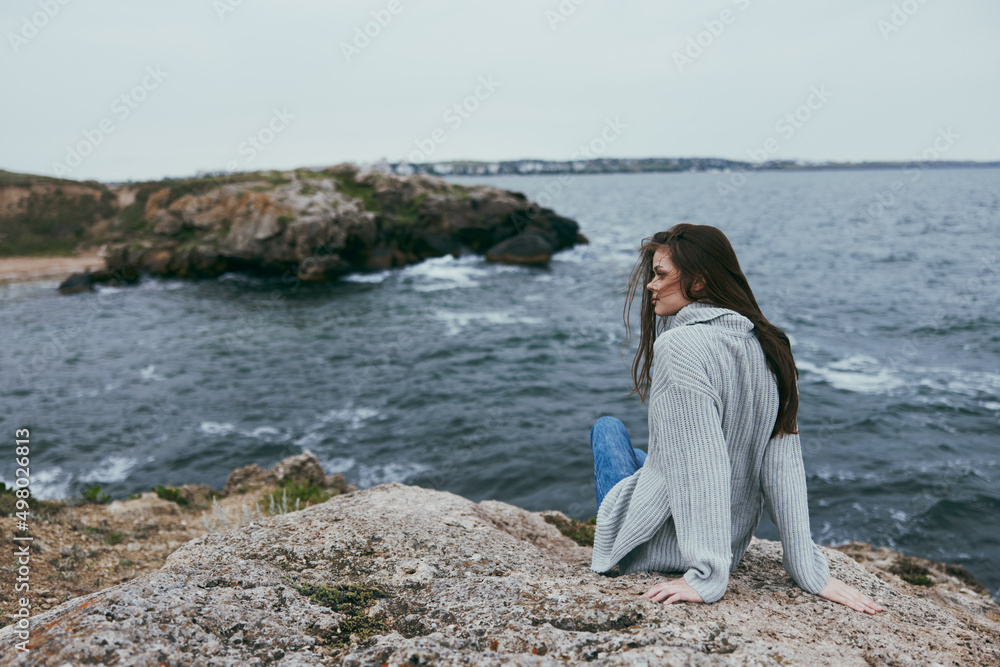 pretty woman long hair nature rocks coast landscape female relaxing