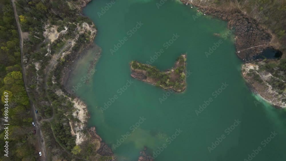 Aerial drone view Basalt columns Amazing industrial landscape, on Emerald lake in a flooded quarry, opencast mine. Open pit mine with lake, travel Ukraine. Aerial drone view Basalt columns Amazing industrial landscape, on Emerald lake in a flooded quarry, opencast mine. Open pit mine with lake, travel Ukraine.
