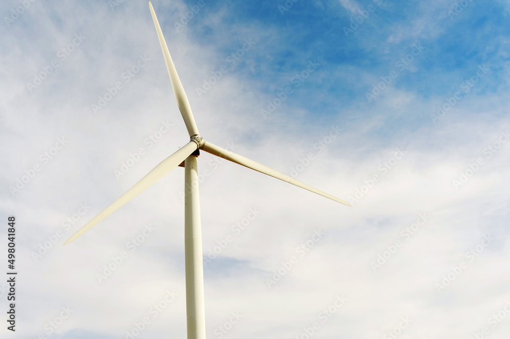 Close-up of wind turbine power plant generating electricity on a beautiful morning; Close-up of wind turbine power plant generating electricity on a beautiful morning;