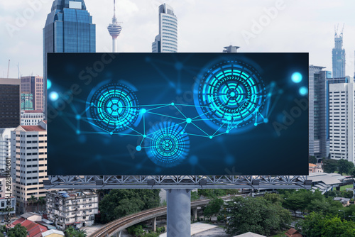 Technology hologram on billboard over panorama city view of Kuala Lumpur. KL is the largest tech hub in Malaysia, Asia. The concept of developing coding and high-tech science.