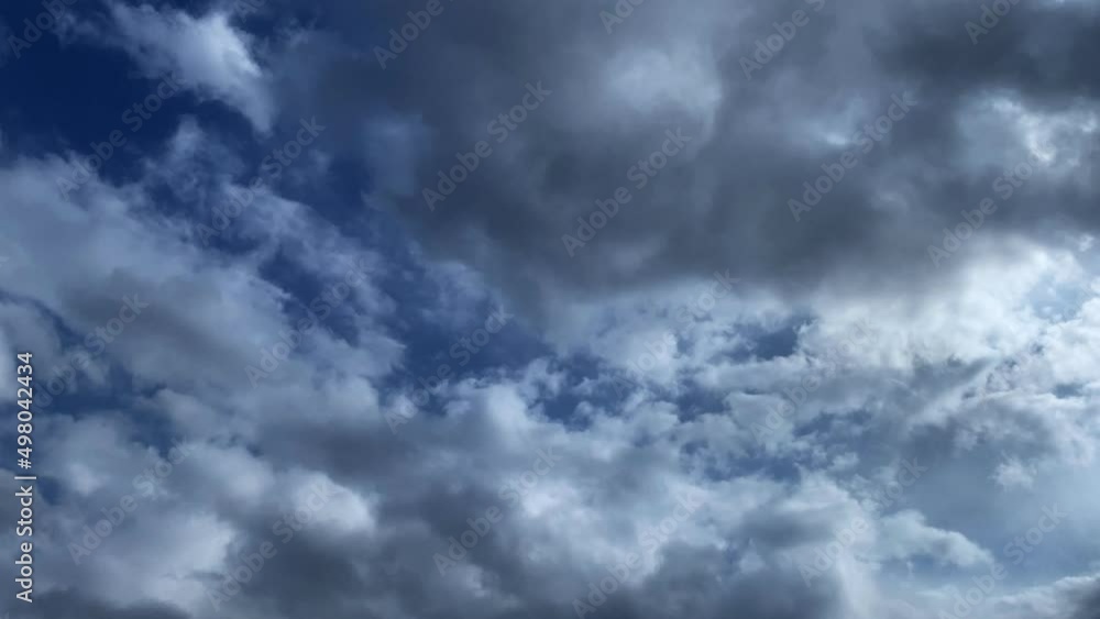 Vertical moving shot of landscape fluffy cloud sky flowing on natural forest at morning. Beautiful blue clouds under meadow and trees on hill. Scenery view. Vertical moving shot of landscape fluffy cloud sky flowing on natural forest at morning. Beautiful blue clouds under meadow and trees on hill. Scenery view.