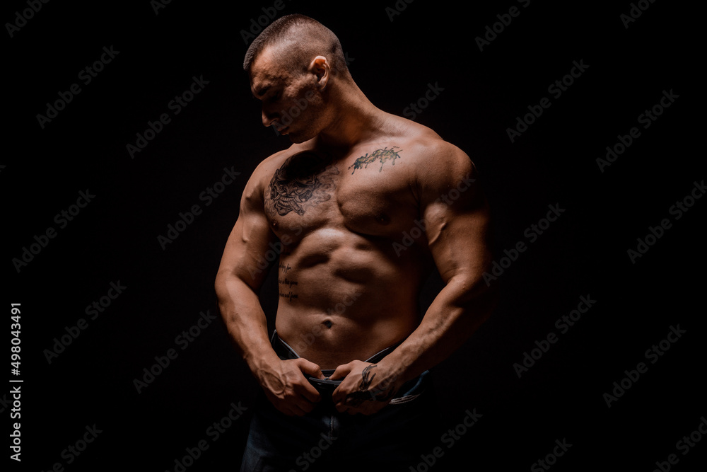 Young bodybuider posing in studio Young bodybuider posing in studio