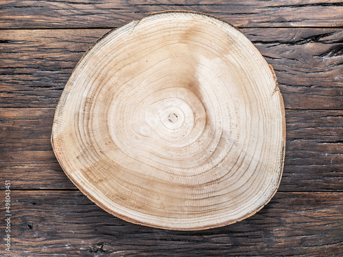 Valokuvatapetti Texture of tree trunk saw cut on old wooden table.