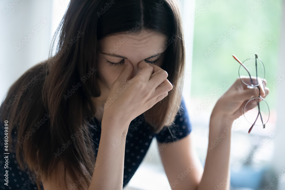 Fotografie Fatigue, overworking, modern tech usage, blurry vision, dry eyes need drops concept