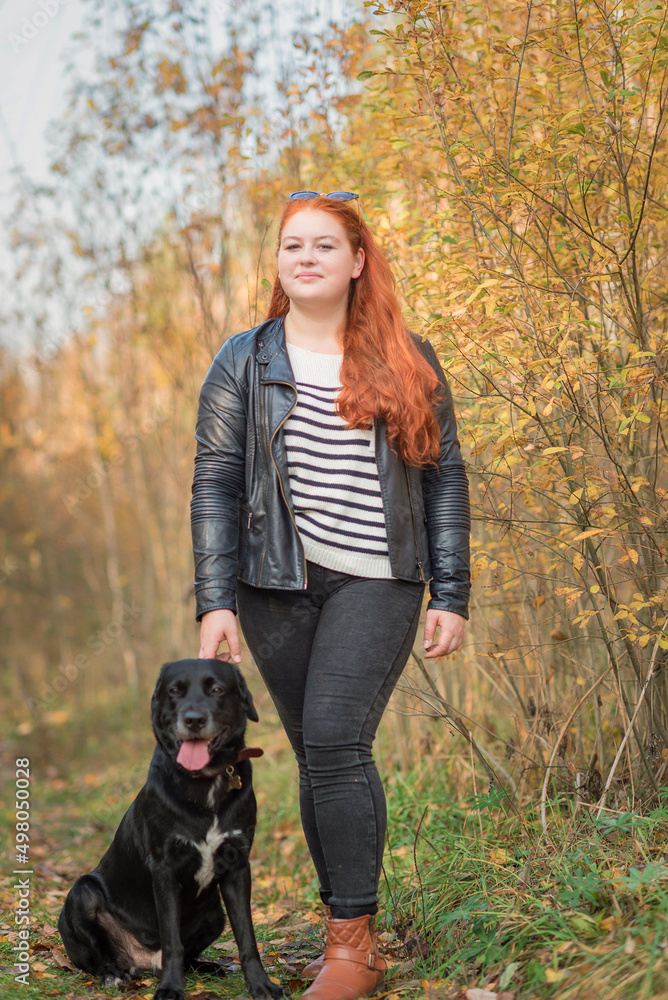 Portrait of a young beautiful red-haired girl in the forest. Portrait of a young beautiful red-haired girl in the forest.