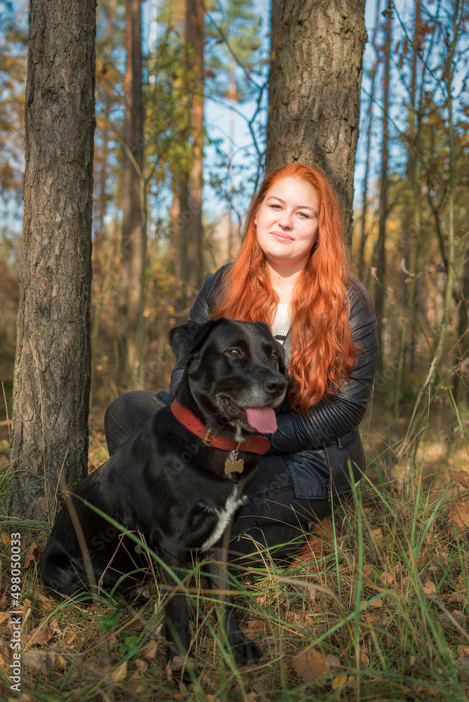 Portrait of a young beautiful red-haired girl in the forest. Portrait of a young beautiful red-haired girl in the forest.