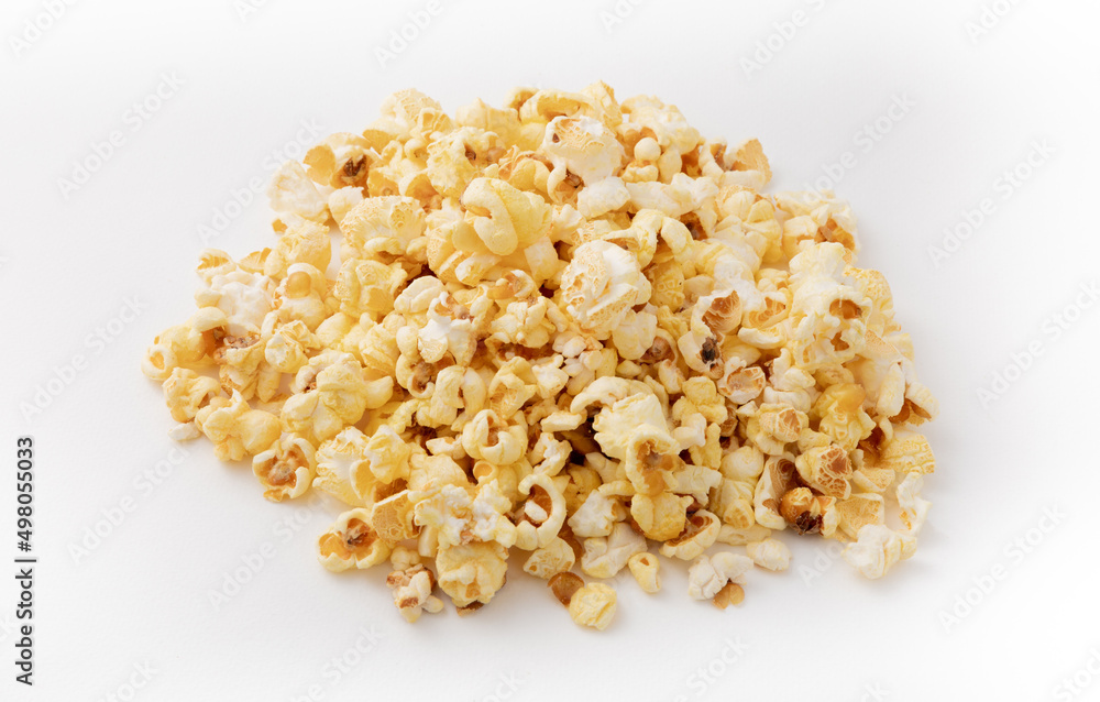 Heap of delicious cheese popcorn isolated on white background. View from above. Snacks.