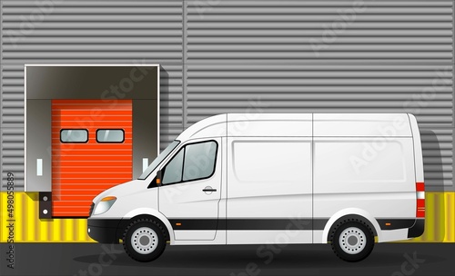 Van cargo van at the gate of a warehouse logistics center, close-up.