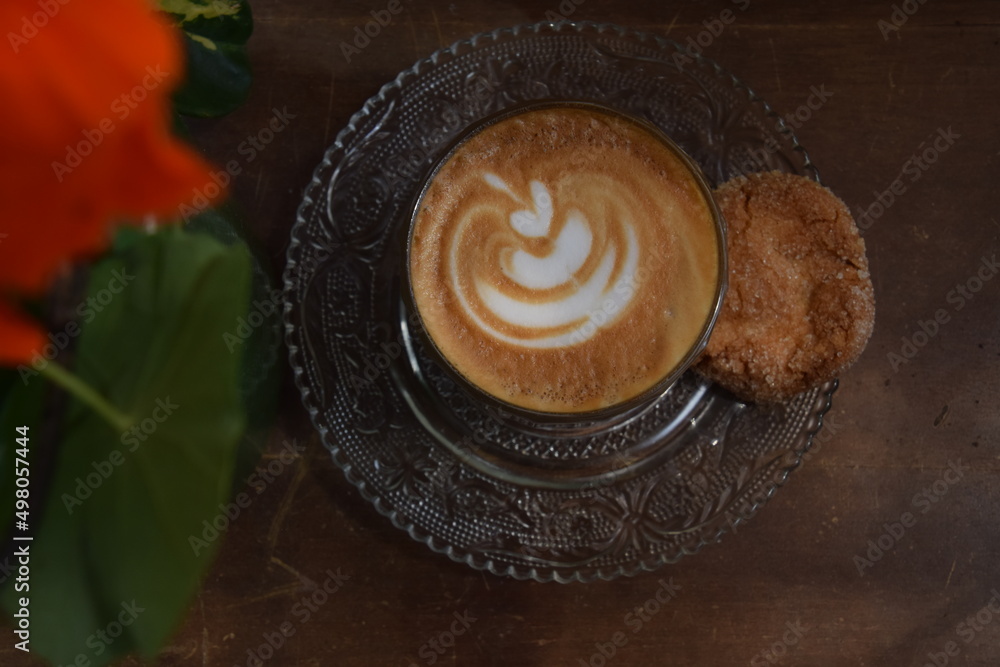 Cappuccino served with a cookie Cappuccino served with a cookie