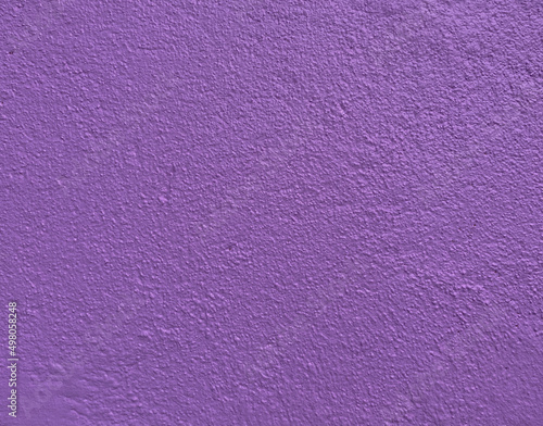 Plum, lilac, amethyst purple plaster textured wall 