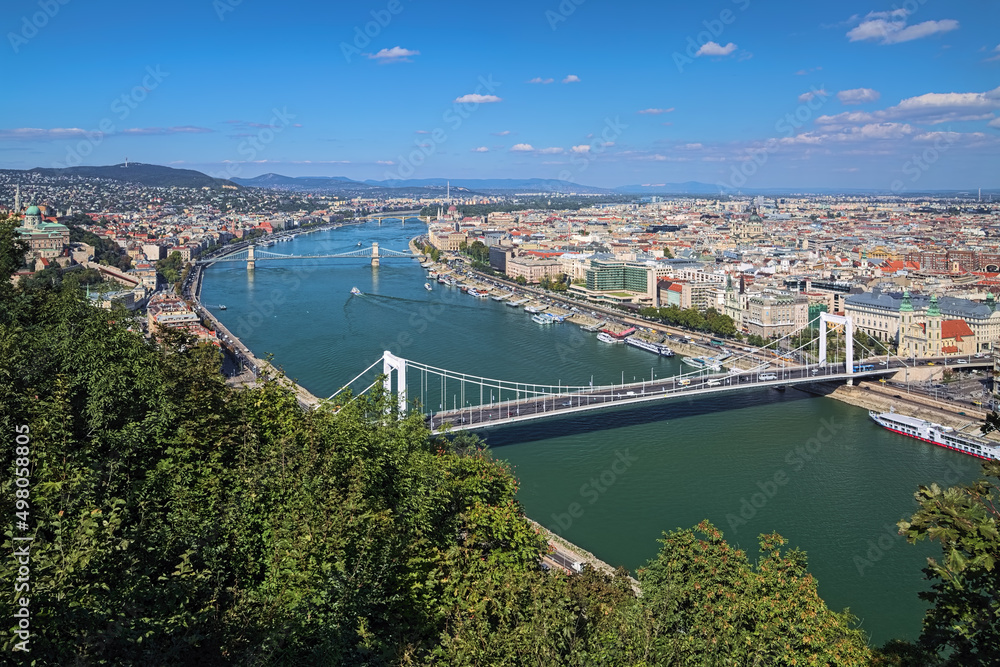 Budapest, Hungary. High angle view on the city with main landmarks and Danube river with bridges. View from Gellert Hill.