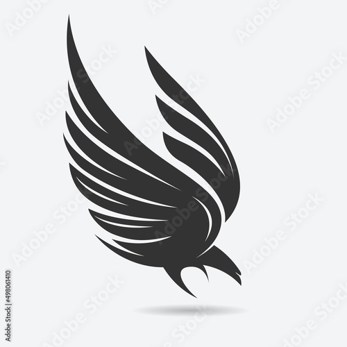 Stylized flying down bird  silhouette in grey and black colors. Attacking hunting Eagle image. Vector illustration. Works well as a tattoo, emblem, print or mascot.