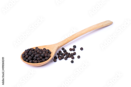 black pepper in a wooden spoon