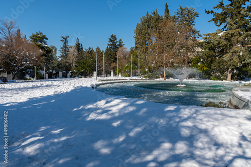 Papagou grove fountain after heavy snowfall- public park photo