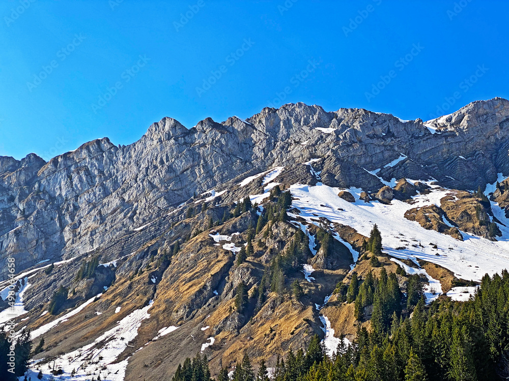 Rocky peak Torberg (2104 m) in the Glarus Alps mountain range, over the Klöntalersee (Kloentalersee) reservoir lake and Klöntal alpine valley - Canton of Glarus, Switzerland / Schweiz