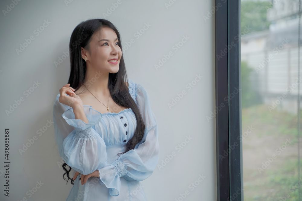 business woman standing in office to relax during lunch break, business asian concept