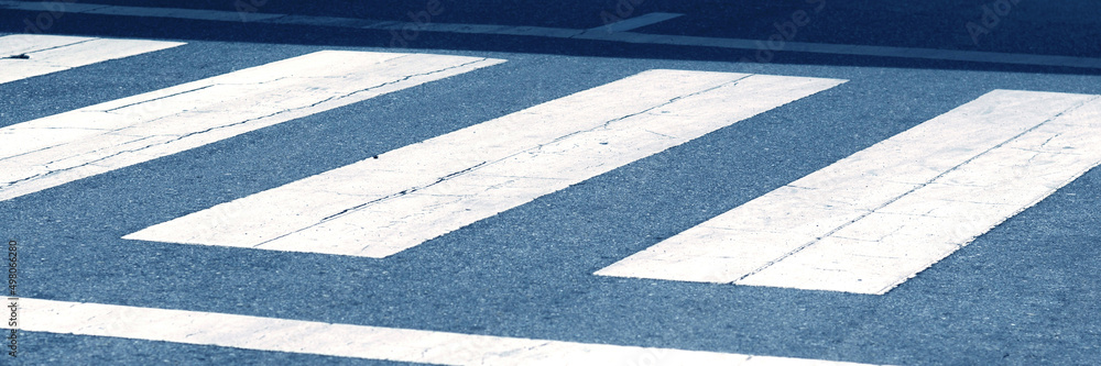 Fototapeta premium White crosswalk for people crossing.