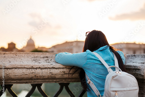 Fényképezés Young woman tourist watching San Pietro Basilica in Vatican city.