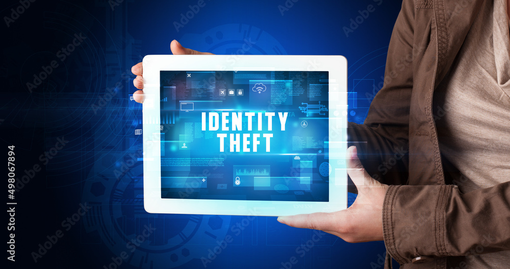 Person holding tablet, security concept Person holding tablet, security concept